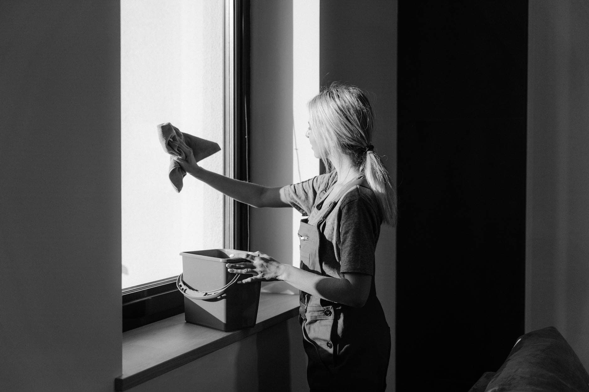 Professional window cleaning in a Connecticut apartment using cloth and bucket — How to Remove Mold From Your Connecticut Bathroom (For Real)